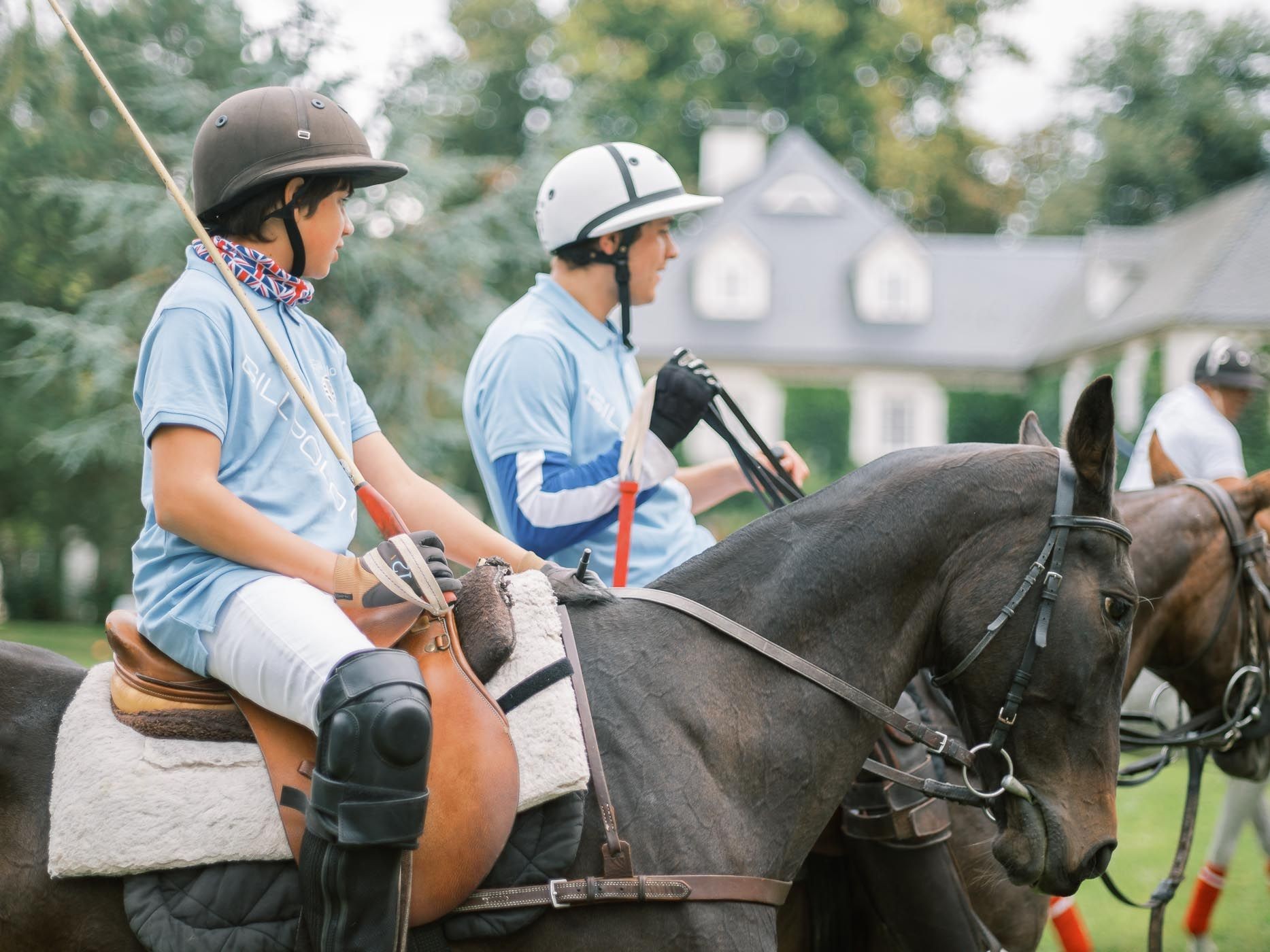 2 young polo players learning the rules of polo